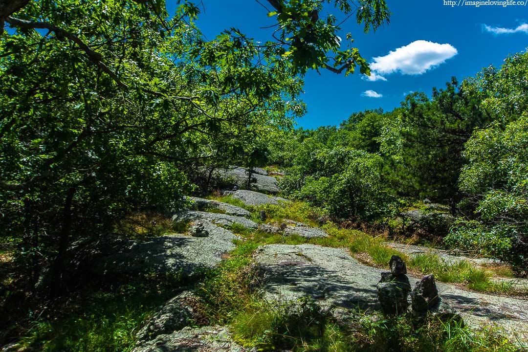 cairns in yellow trail